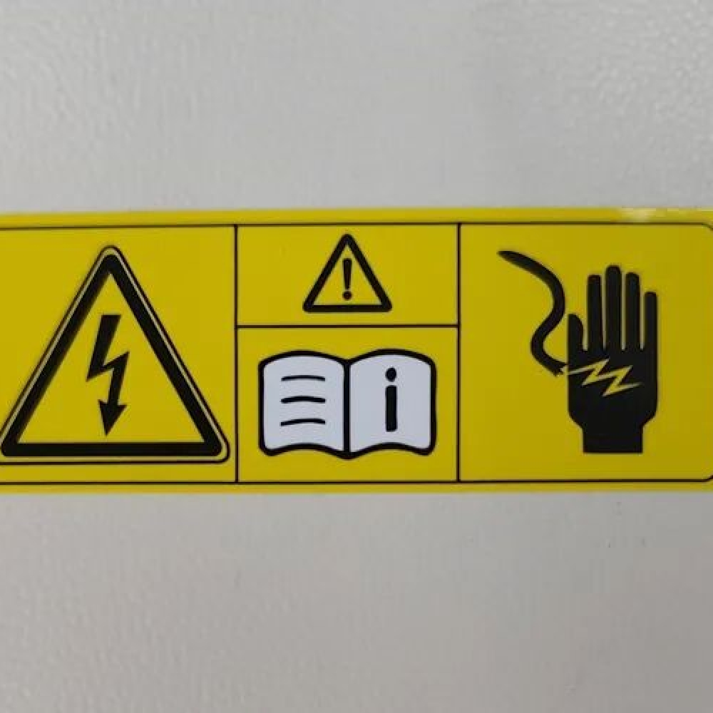Warning label for automotive wireless charger cover plates