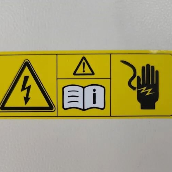 Warning label for automotive wireless charger cover plates